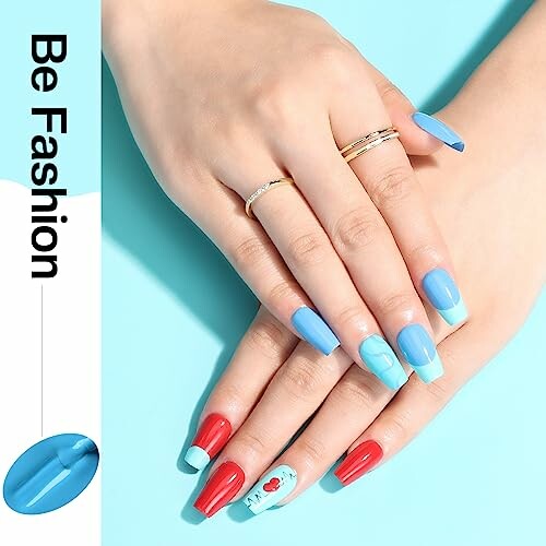 Hands with colorful manicure featuring blue and red nail art.