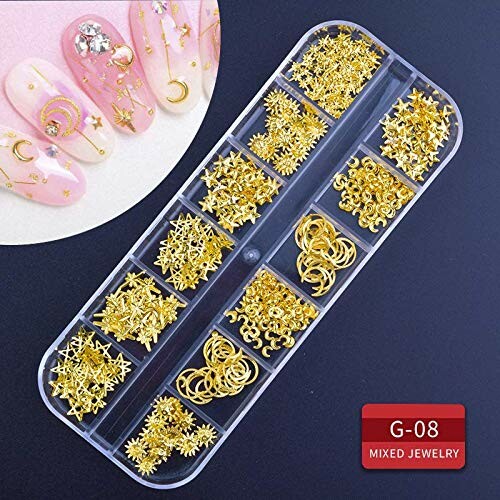Gold nail art decorations in various shapes with pink nails.