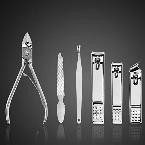 Set of manicure and pedicure tools on a dark background.