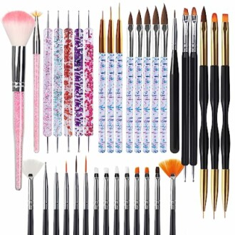 Assorted nail art brushes in various colors and designs.