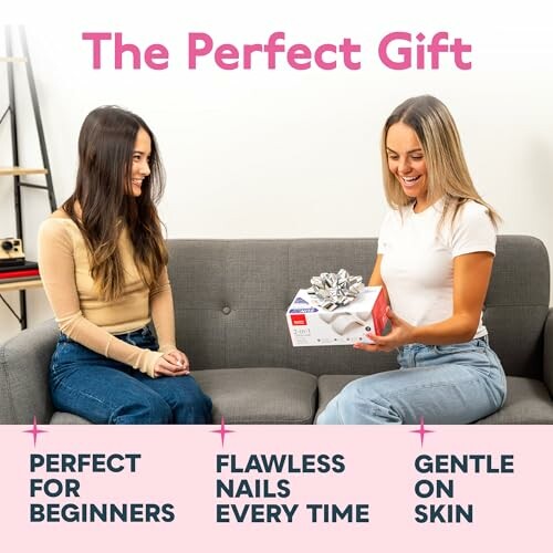 Two women sitting on a couch exchanging a nail care gift.