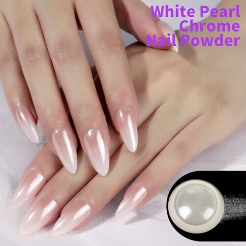 Hands with white pearl chrome nail powder manicure.